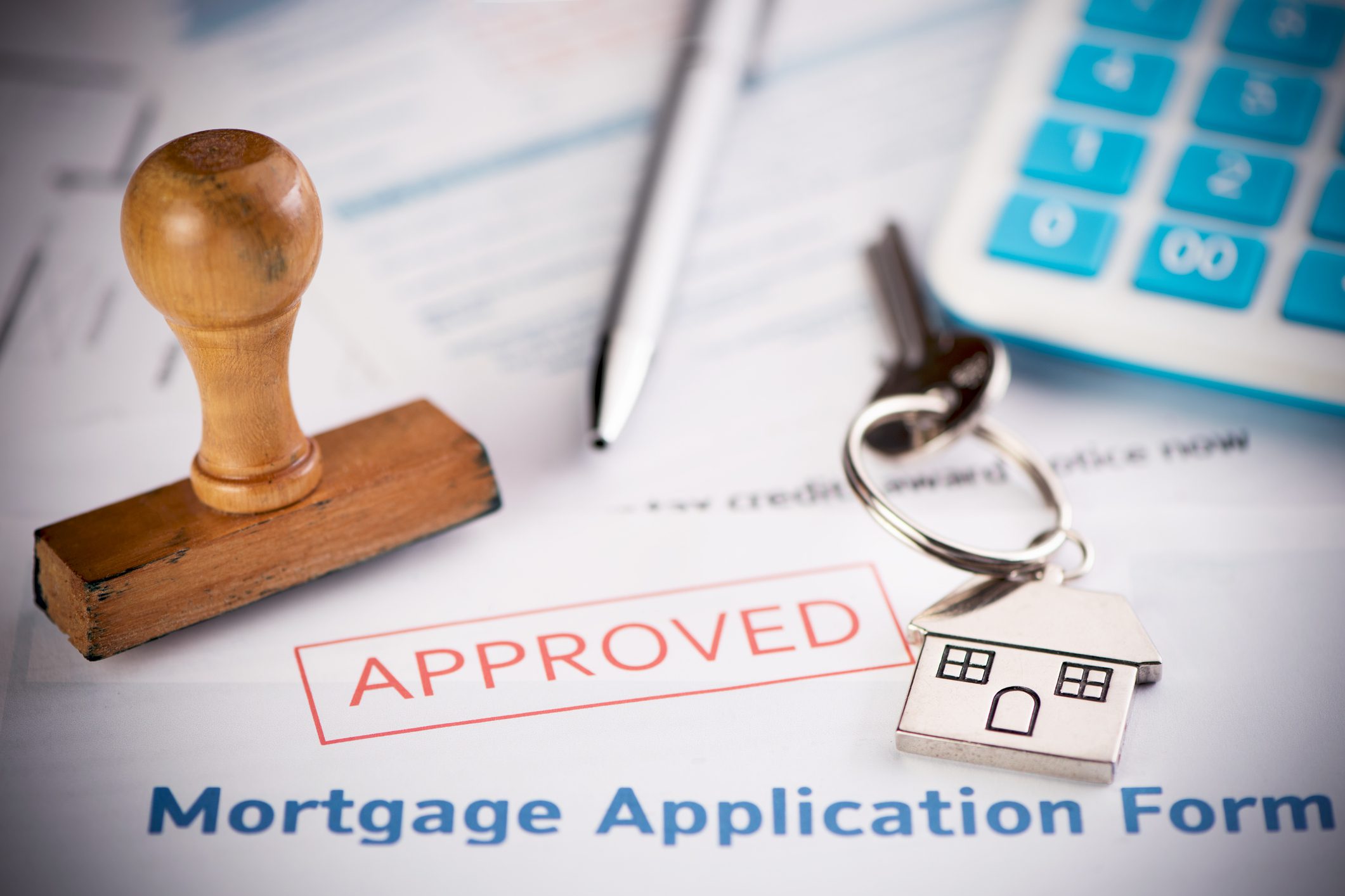 House keychain on approved mortgage form