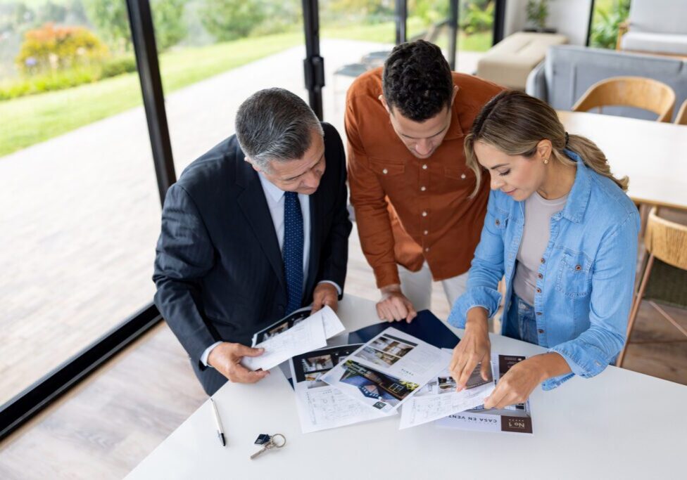 Real estate agents reviewing property documents